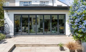 A bi-fold door installation on a modern extension